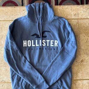 Hollister Men's Dusty Blue Pullover Hoodie with White Logo
